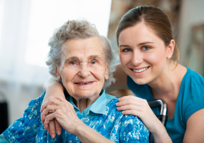 senior woman with her caregiver at home